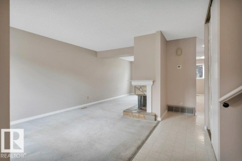 #22 1651 46 St Nw, Edmonton, AB - Indoor Photo Showing Other Room With Fireplace