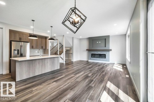 13 Hillwood Terrace, Spruce Grove, AB - Indoor Photo Showing Kitchen With Fireplace With Upgraded Kitchen