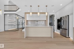 Open-concept living area featuring light wood-finish flooring - 