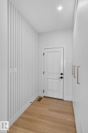 Modern interior featuring vertical slat wall detailing - 