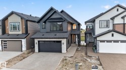 Contemporary two-story residence featuring a dark vertical siding and white brick facade - 