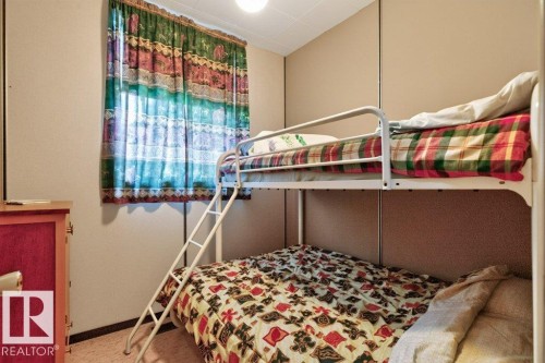 #506 54411 Rge Road 40, Rural Lac Ste. Anne County, AB - Indoor Photo Showing Bedroom