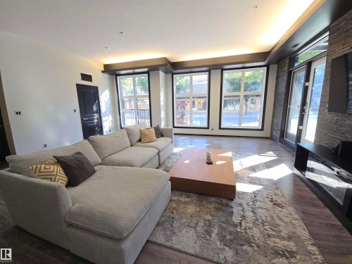 #106 10531 117 St Nw, Edmonton, AB - Indoor Photo Showing Living Room With Fireplace