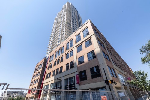 Modern high-rise residential building with a multi-story commercial base - #2402 10410 102 Av Nw, Edmonton, AB - Outdoor With Facade