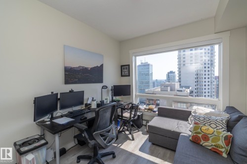 Expansive window offering urban high-rise panoramas - #2402 10410 102 Av Nw, Edmonton, AB - Indoor Photo Showing Office