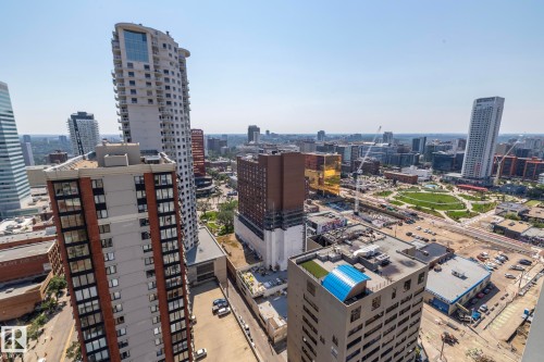 Expansive city panorama showcasing multiple high-rise buildings and contemporary urban architecture - #2402 10410 102 Av Nw, Edmonton, AB - Outdoor With View