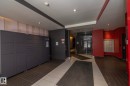 Lobby area featuring parcel lockers and individual mailboxes - #2402 10410 102 Av Nw, Edmonton, AB  - Indoor Photo Showing Other Room 