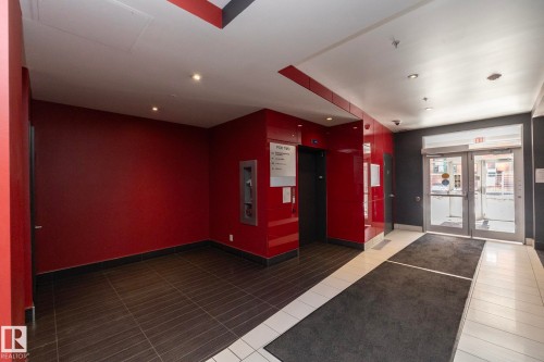 Building common area featuring a tile floor, recessed lighting, and an elevator bank - #2402 10410 102 Av Nw, Edmonton, AB - Indoor Photo Showing Other Room