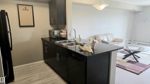 #310 5370 Chappelle Rd Sw Sw, Edmonton, AB - Indoor Photo Showing Kitchen With Double Sink