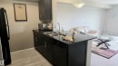 #310 5370 Chappelle Rd Sw Sw, Edmonton, AB  - Indoor Photo Showing Kitchen With Double Sink 