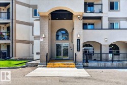 Building entrance featuring a prominent arched portico - 