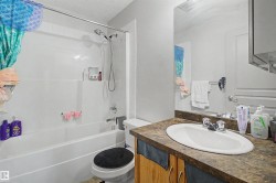 White tub-shower combination with a chrome shower head and faucet - 
