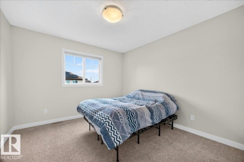 100 Meadowland Crescent, Spruce Grove, AB - Indoor Photo Showing Bedroom