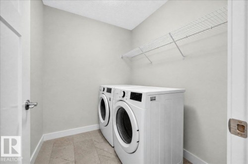 100 Meadowland Crescent, Spruce Grove, AB - Indoor Photo Showing Laundry Room