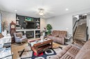 3808 Triomphe Boulevard, Beaumont, AB  - Indoor Photo Showing Living Room With Fireplace 