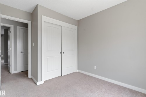 Neutral gray wall paint with white trim - #62 675 Watt Bv Sw, Edmonton, AB - Indoor Photo Showing Other Room