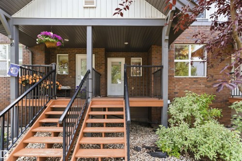 Brick facade building featuring two separate entryways - #62 675 Watt Bv Sw, Edmonton, AB - Outdoor