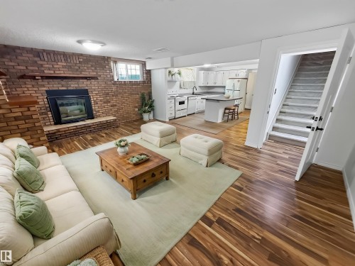 11327 25 Avenue Nw, Edmonton, AB - Indoor Photo Showing Living Room With Fireplace