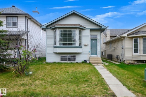 Light blue siding exterior featuring a prominent bay window with white framing - 9113 166 Avenue Nw, Edmonton, AB - Outdoor
