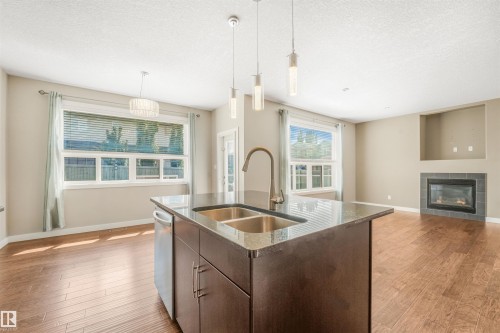 13525 162A Avenue Nw, Edmonton, AB - Indoor Photo Showing Kitchen With Fireplace With Double Sink With Upgraded Kitchen