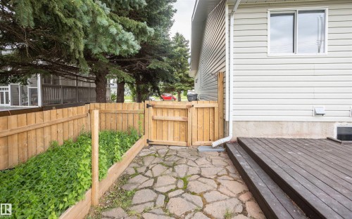 Exterior deck with steps, wood plank fencing, and a flagstone pathway - 5116 51 Avenue, Pickardville, AB - Outdoor