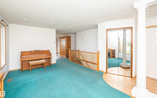 Open concept area featuring teal carpeting, white walls, and recessed lighting - 5116 51 Avenue, Pickardville, AB - Indoor Photo Showing Other Room