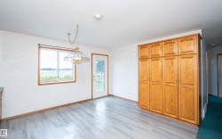 Light wood-finish cabinetry provides extensive storage - 
