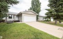 Exterior featuring beige siding, an attached garage with a white door, and a concrete driveway - 5116 51 Avenue, Pickardville, AB  - Outdoor 