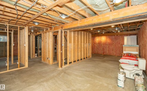 Unfinished basement space featuring exposed wooden framing, concrete flooring, and visible insulation - 5116 51 Avenue, Pickardville, AB - Indoor Photo Showing Basement