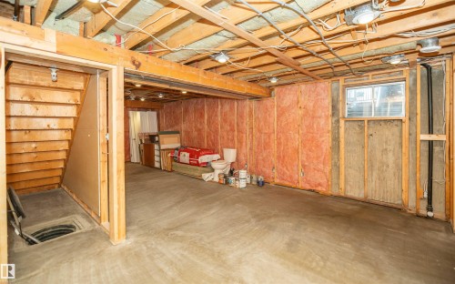 Unfinished lower level with exposed ceiling joists, concrete flooring, and insulated walls - 5116 51 Avenue, Pickardville, AB - Indoor
