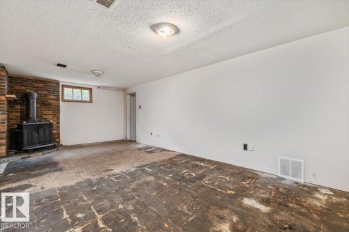 10415 98 Avenue, Fort Saskatchewan, AB - Indoor Photo Showing Other Room With Fireplace