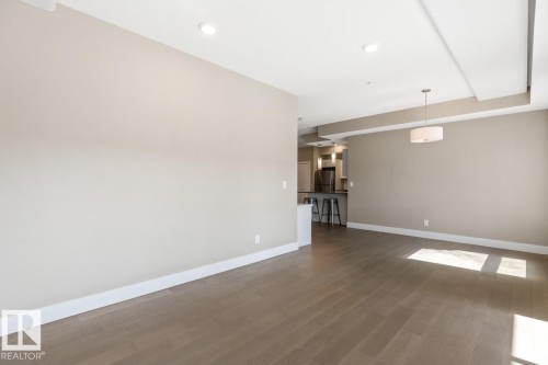 Spacious Living Room With Sliding Doors To South Facing Balcony. - #203 10006 83 Av Nw, Edmonton, AB - Indoor Photo Showing Other Room