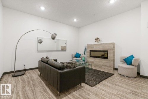 Lobby Area On The Main Floor. - #203 10006 83 Av Nw, Edmonton, AB - Indoor With Fireplace