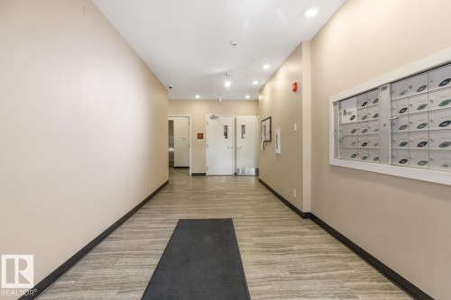 Entrance & Hallway To The Elevator From The Building's Front Door. - #203 10006 83 Av Nw, Edmonton, AB - Indoor Photo Showing Other Room