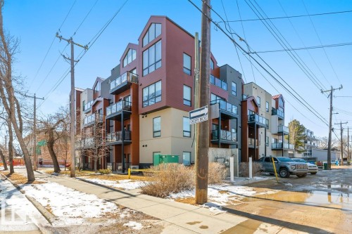 Back Of The Building With Paved Laneway. - #203 10006 83 Av Nw, Edmonton, AB - Outdoor With Facade