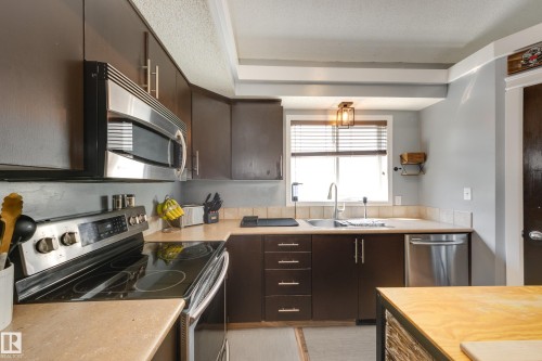7904 13 Avenue Sw, Edmonton, AB - Indoor Photo Showing Kitchen With Double Sink