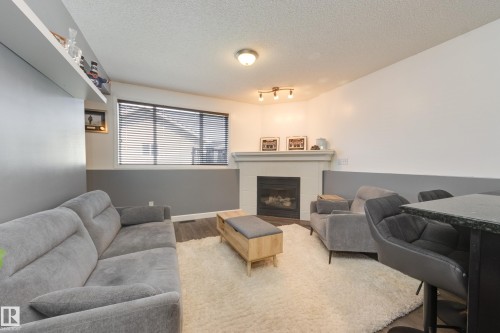 7904 13 Avenue Sw, Edmonton, AB - Indoor Photo Showing Living Room With Fireplace