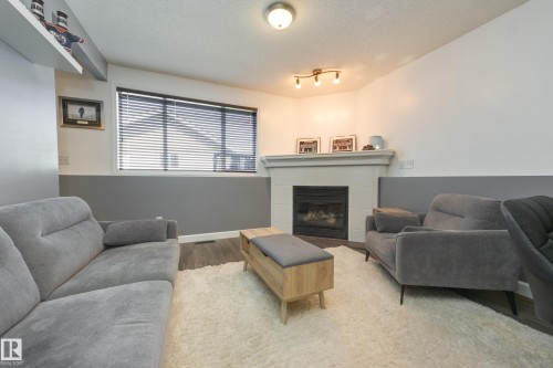 7904 13 Avenue Sw, Edmonton, AB - Indoor Photo Showing Living Room With Fireplace
