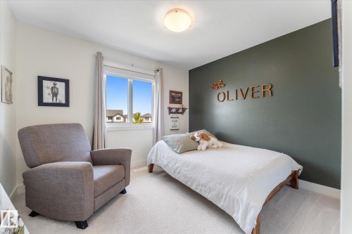 Bright room featuring a single window, recessed lighting, and light-toned carpeting - 6875 Evans Wynd Nw, Edmonton, AB - Indoor Photo Showing Bedroom