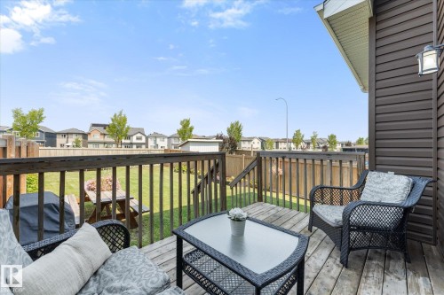 Expansive wood deck featuring a railing system and steps to the backyard - 6875 Evans Wynd Nw, Edmonton, AB - Outdoor With Deck Patio Veranda With Exterior