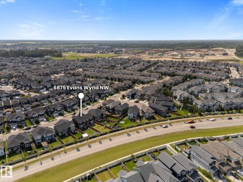 Aerial view of a residential neighborhood with numerous detached and attached homes - 6875 Evans Wynd Nw, Edmonton, AB - Outdoor With View