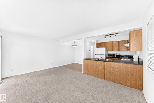 #93 230 Edwards Dr Sw, Edmonton, AB - Indoor Photo Showing Kitchen With Double Sink