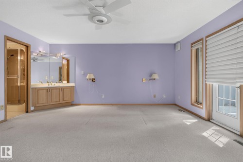 Room with light purple walls and light-colored carpeting - 120 Ironwood Place Nw, Edmonton, AB - Indoor Photo Showing Other Room