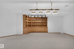 Built-in wood cabinetry with open shelving and lower storage - 