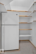 White top-freezer refrigerator with integrated shelving - 