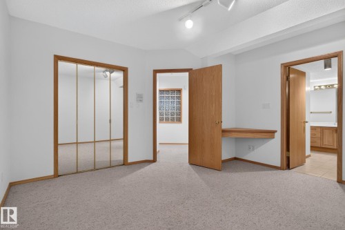 Carpeted interior space featuring white walls and light wood trim - 120 Ironwood Place Nw, Edmonton, AB - Indoor Photo Showing Other Room