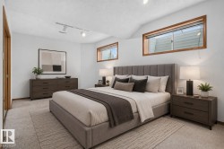 Bright bedroom space with light-colored carpeting - 