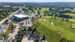 Expansive green golf course with manicured fairways and sand traps - 