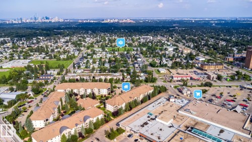 Aerial perspective of a multi-building residential complex, featuring multiple stories and a consistent roofline - #209 8912 156 St Nw, Edmonton, AB - Outdoor With View