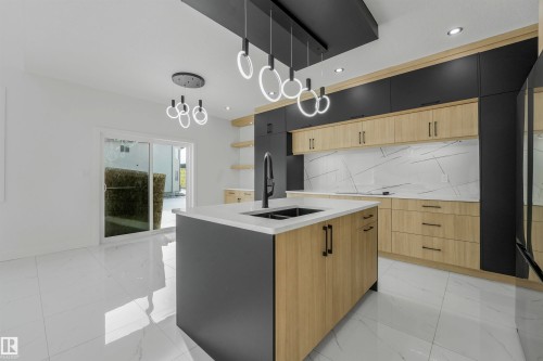 3033 7A Avenue Sw, Edmonton, AB - Indoor Photo Showing Kitchen With Double Sink With Upgraded Kitchen